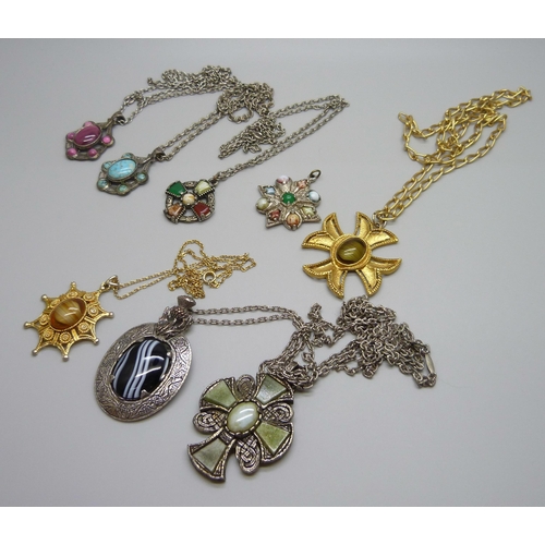 1107 - A collection of costume pendants and chains including Miracle