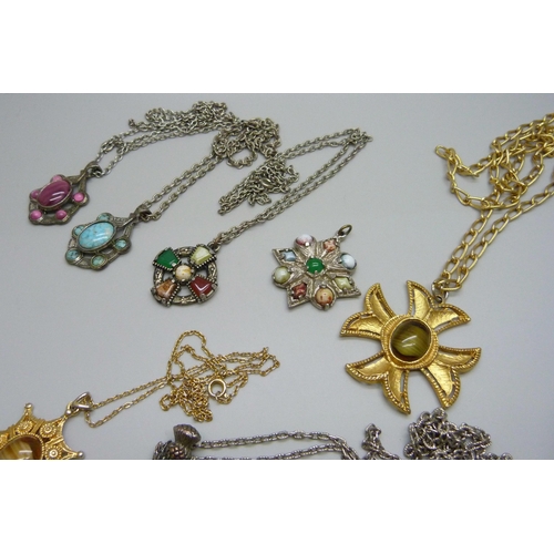 1107 - A collection of costume pendants and chains including Miracle