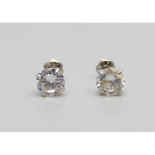 1124 - A pair of 14ct white gold earrings set with white stones, 1.1g