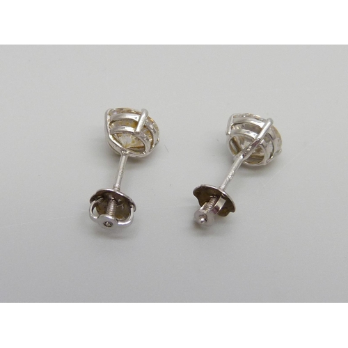 1124 - A pair of 14ct white gold earrings set with white stones, 1.1g