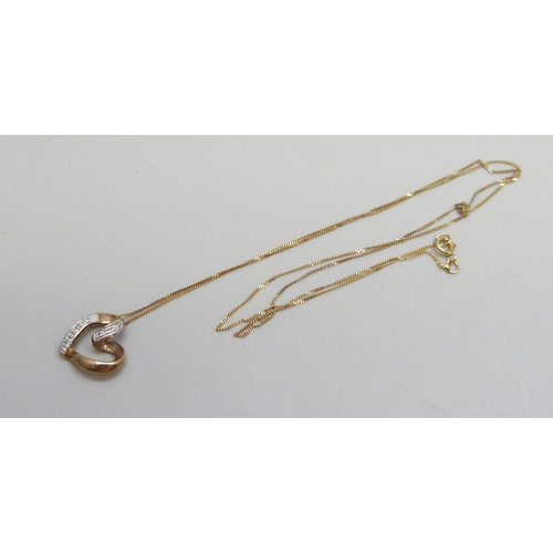 1137 - A 9ct gold and diamond heart pendant on a chain, 1.2cm, 1.4g