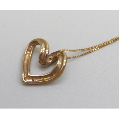 1137 - A 9ct gold and diamond heart pendant on a chain, 1.2cm, 1.4g