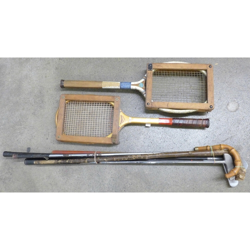 1159 - Two tennis raquets, golf clubs and a walking stick **PLEASE NOTE THIS LOT IS NOT ELIGIBLE FOR IN-HOU... 