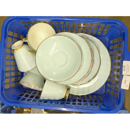 1176 - Four boxes of assorted china including Sylvac, an Art Deco glass dressing table set, a Delft charger... 