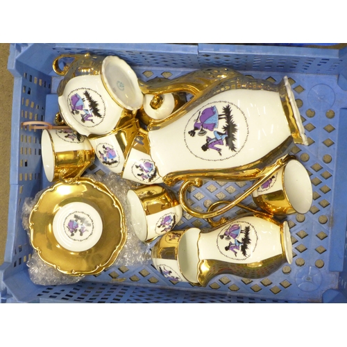 1176 - Four boxes of assorted china including Sylvac, an Art Deco glass dressing table set, a Delft charger... 