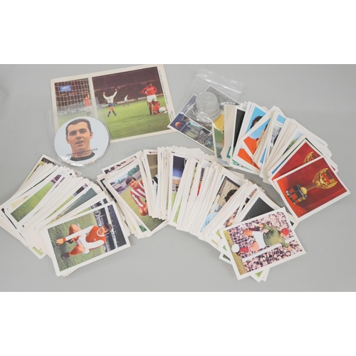 633 - A collection of FKS football stickers, discs and football coin tokens