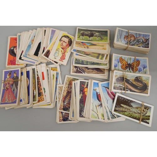 655 - A collection of cigarette cards, loose and in an album