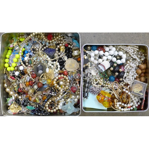 668 - Two tins of costume jewellery