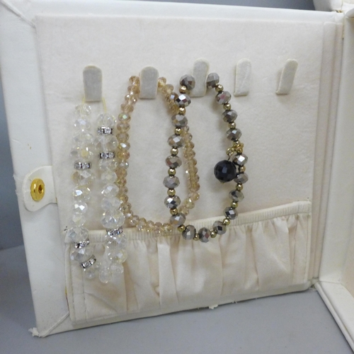 673 - A jewellery box containing costume jewellery