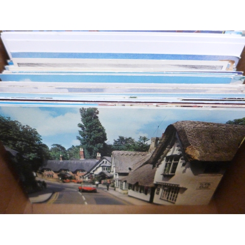 694 - Postcards; a box of postcards, vintage to modern