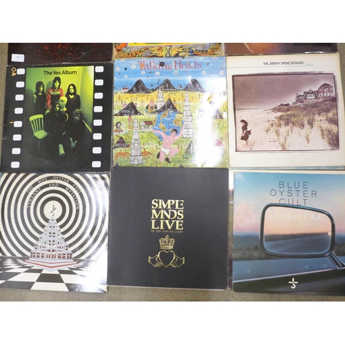 697 - A collection of LP records including Kevin McDermott orchestra, Blue Oyster Cult x2, Simple Minds, T... 