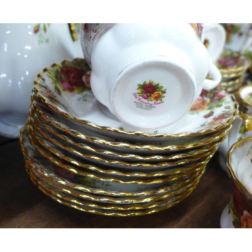 706 - A Royal Albert Old Country Roses tea and coffee set with coffee pot, fourteen tea cups, nineteen sau... 