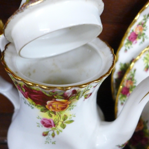 706 - A Royal Albert Old Country Roses tea and coffee set with coffee pot, fourteen tea cups, nineteen sau... 