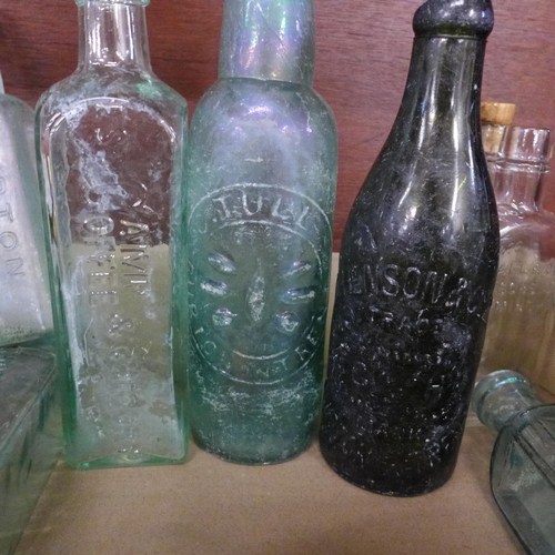 712 - A collection of bottles, mainly chemists bottles and some tins **PLEASE NOTE THIS LOT IS NOT ELIGIBL... 