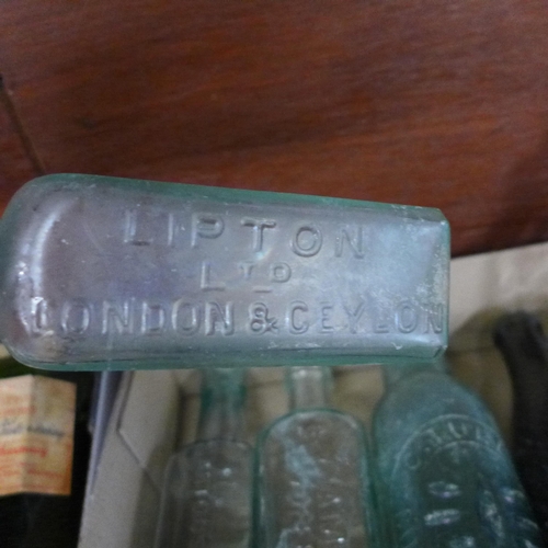 712 - A collection of bottles, mainly chemists bottles and some tins **PLEASE NOTE THIS LOT IS NOT ELIGIBL... 