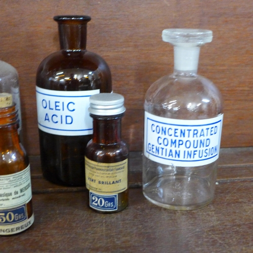 720 - Nine chemists bottles and two measures **PLEASE NOTE THIS LOT IS NOT ELIGIBLE FOR IN-HOUSE POSTING A... 