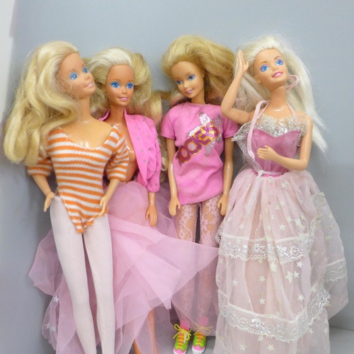 724 - A collection of eight Barbie dolls and a horse