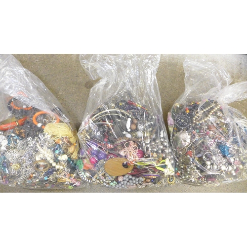 750 - Three large bags of costume jewellery