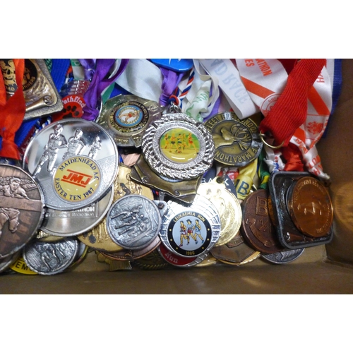 779 - A large collection of 1980s and 1990s Marathon and road racers medals and awards