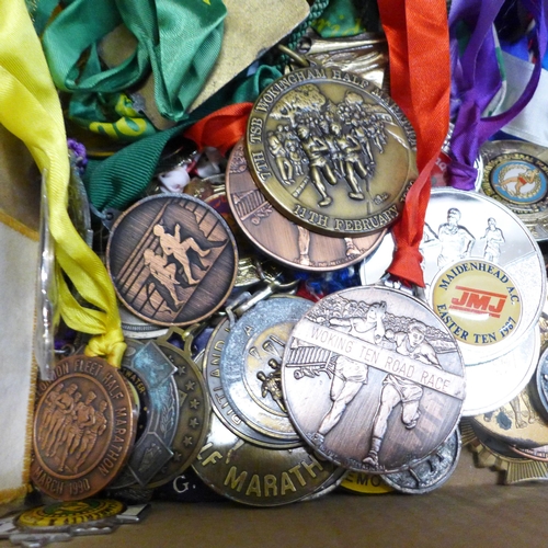 779 - A large collection of 1980s and 1990s Marathon and road racers medals and awards