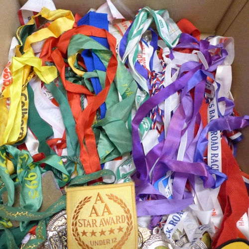 779 - A large collection of 1980s and 1990s Marathon and road racers medals and awards