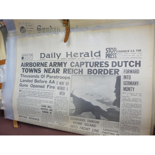 798 - A leather suitcase with a collection of WWII period newspapers, various editions