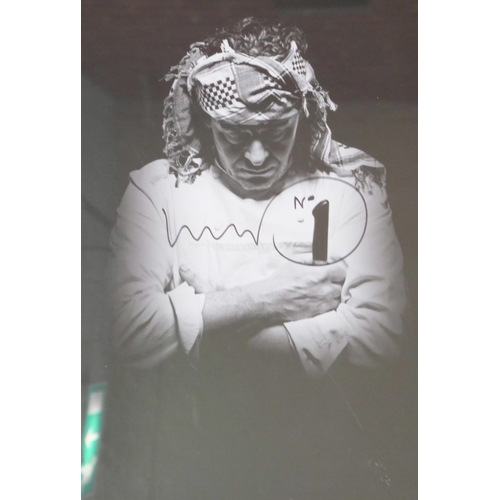 809 - Marco Pierre White; a black and white photograph of the celebrity chef, signed, no CoA