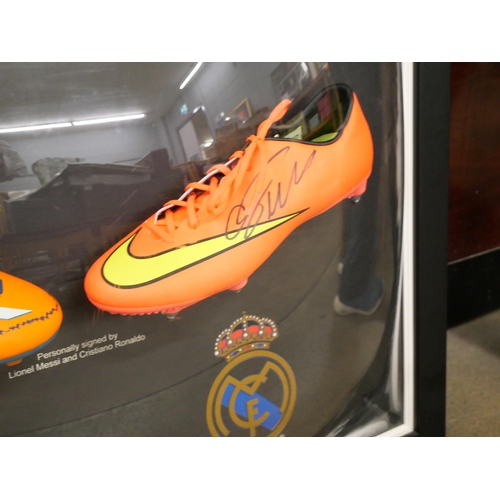 814 - A Lionel Messi and Cristiano Ronaldo dual signed boot presentation with Superstars CoA