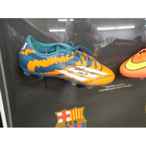 814 - A Lionel Messi and Cristiano Ronaldo dual signed boot presentation with Superstars CoA