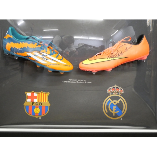 814 - A Lionel Messi and Cristiano Ronaldo dual signed boot presentation with Superstars CoA