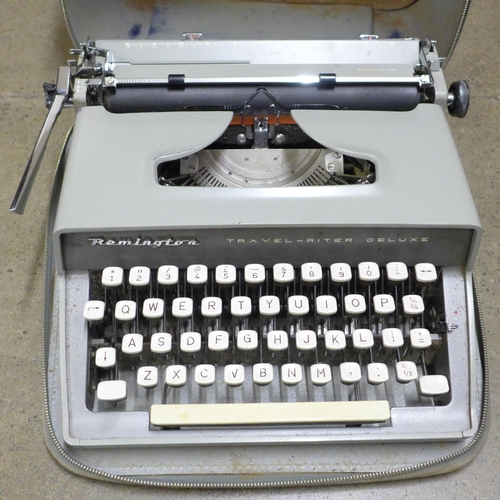 832 - A Remington typewriter with carbon copy paper and accessories, reels, etc., cased