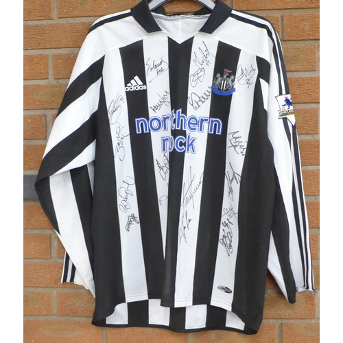 842 - Newcastle United Football Club; a 2003 to 2005 football shirt, signed by the team, no CoA