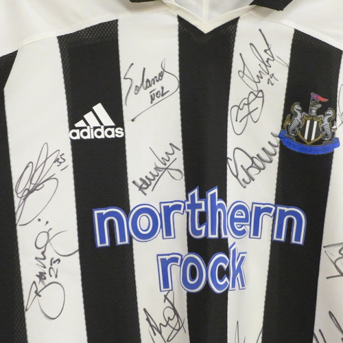 842 - Newcastle United Football Club; a 2003 to 2005 football shirt, signed by the team, no CoA