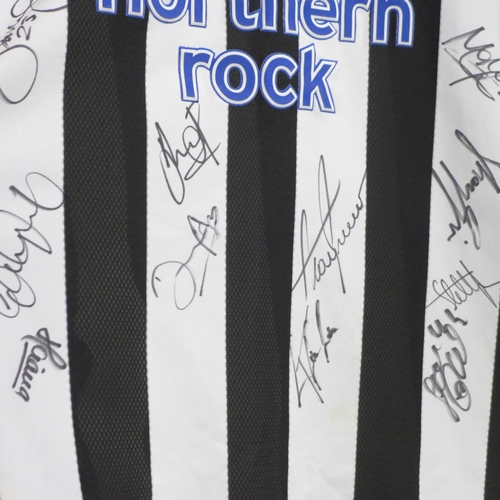 842 - Newcastle United Football Club; a 2003 to 2005 football shirt, signed by the team, no CoA