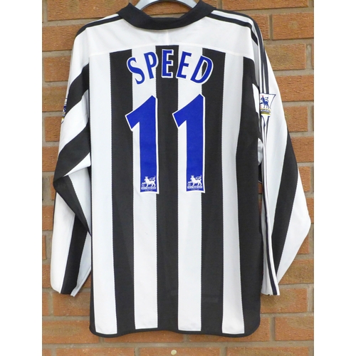 842 - Newcastle United Football Club; a 2003 to 2005 football shirt, signed by the team, no CoA