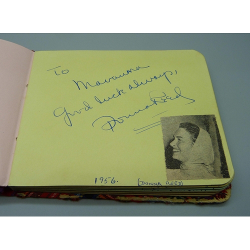 852 - A 1950s autograph album with signatures including Lionel Jeffries, Jim Reeves, Dickie Valentine, Chr... 