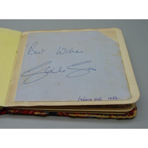 852 - A 1950s autograph album with signatures including Lionel Jeffries, Jim Reeves, Dickie Valentine, Chr... 