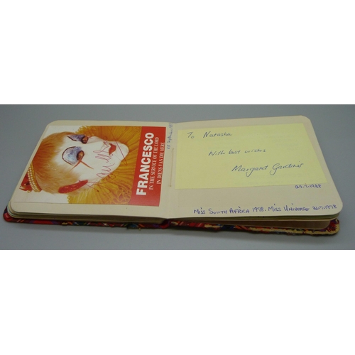 852 - A 1950s autograph album with signatures including Lionel Jeffries, Jim Reeves, Dickie Valentine, Chr... 