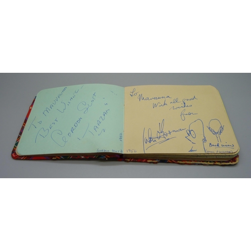 852 - A 1950s autograph album with signatures including Lionel Jeffries, Jim Reeves, Dickie Valentine, Chr... 