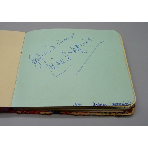 852 - A 1950s autograph album with signatures including Lionel Jeffries, Jim Reeves, Dickie Valentine, Chr... 