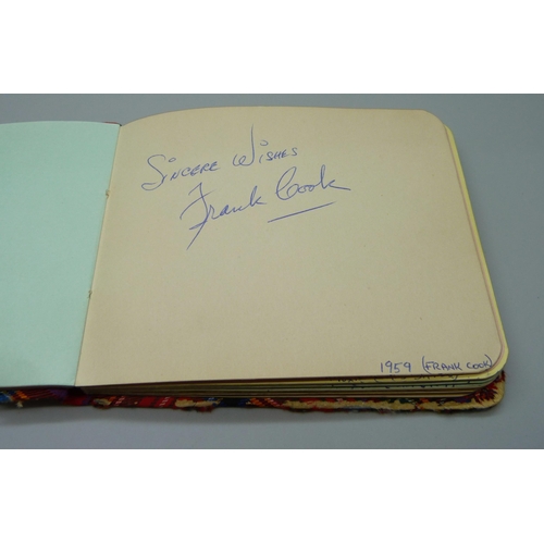 852 - A 1950s autograph album with signatures including Lionel Jeffries, Jim Reeves, Dickie Valentine, Chr... 