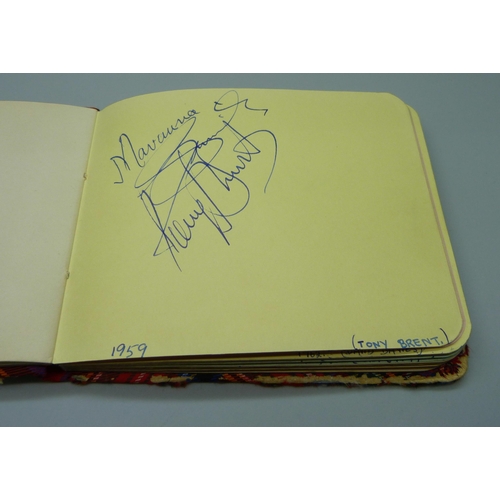 852 - A 1950s autograph album with signatures including Lionel Jeffries, Jim Reeves, Dickie Valentine, Chr... 