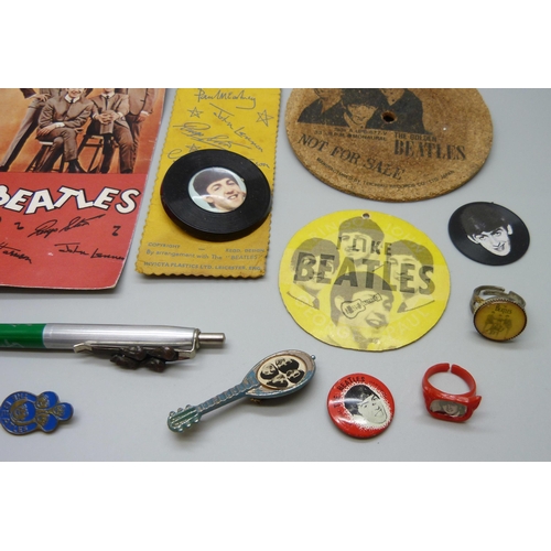 854 - The Beatles, a collection of badges, etc.