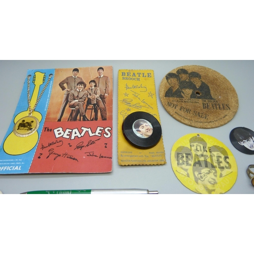 854 - The Beatles, a collection of badges, etc.