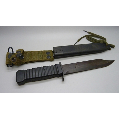 867 - A US Commando knife in scabbard