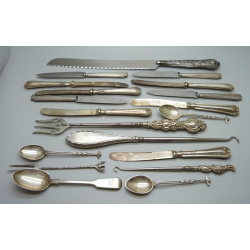 893 - Four silver spoons and a silver pickle fork, 71g, and a collection of silver handled cutlery