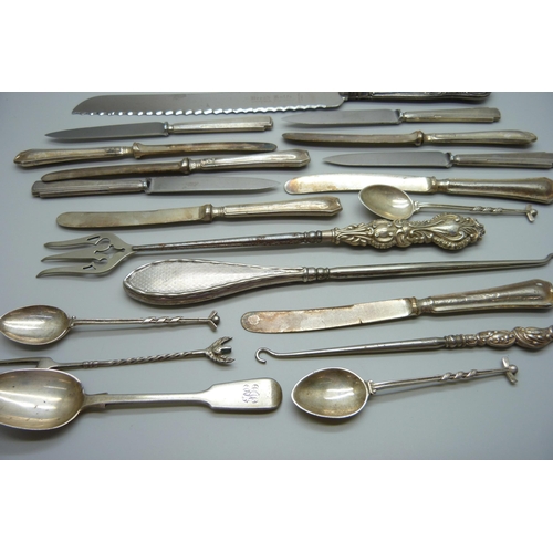 893 - Four silver spoons and a silver pickle fork, 71g, and a collection of silver handled cutlery