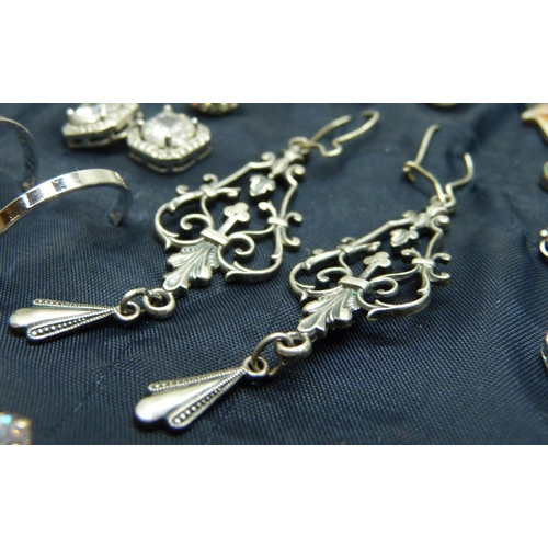 916 - A collection of 39 pairs of silver earrings