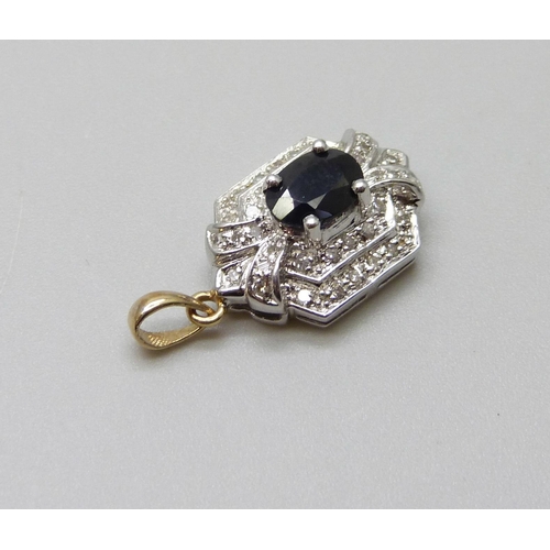 963 - A 9ct gold, sapphire and diamond pendant, 2.9g, 12mm wide