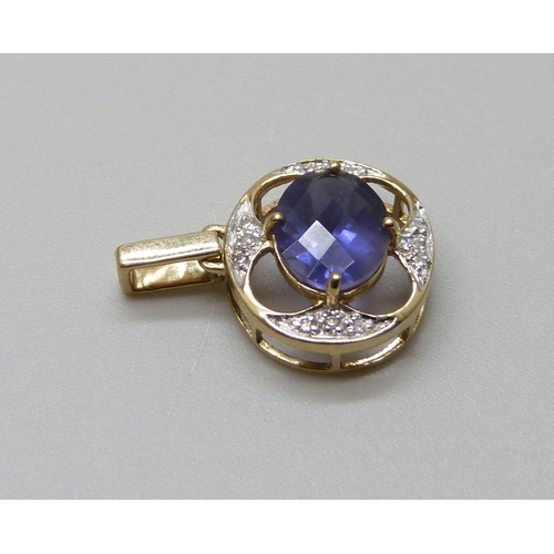 964 - A 9ct gold pendant, set with diamonds and a blue stone, 1.5g, 14mm wide